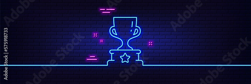 Neon light glow effect. Winner cup line icon. Award trophy sign. Best achievement symbol. 3d line neon glow icon. Brick wall banner. Winner cup outline. Vector
