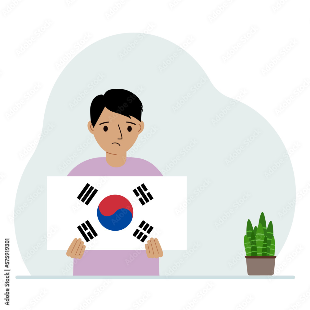 A little boy is holding the flag of South Korea. The concept of demonstration, national holiday, independence day or patriotism. Nationality. A little boy is holding the flag of South Korea. The concept of demonstration, national holiday, independence day or patriotism. Nationality.