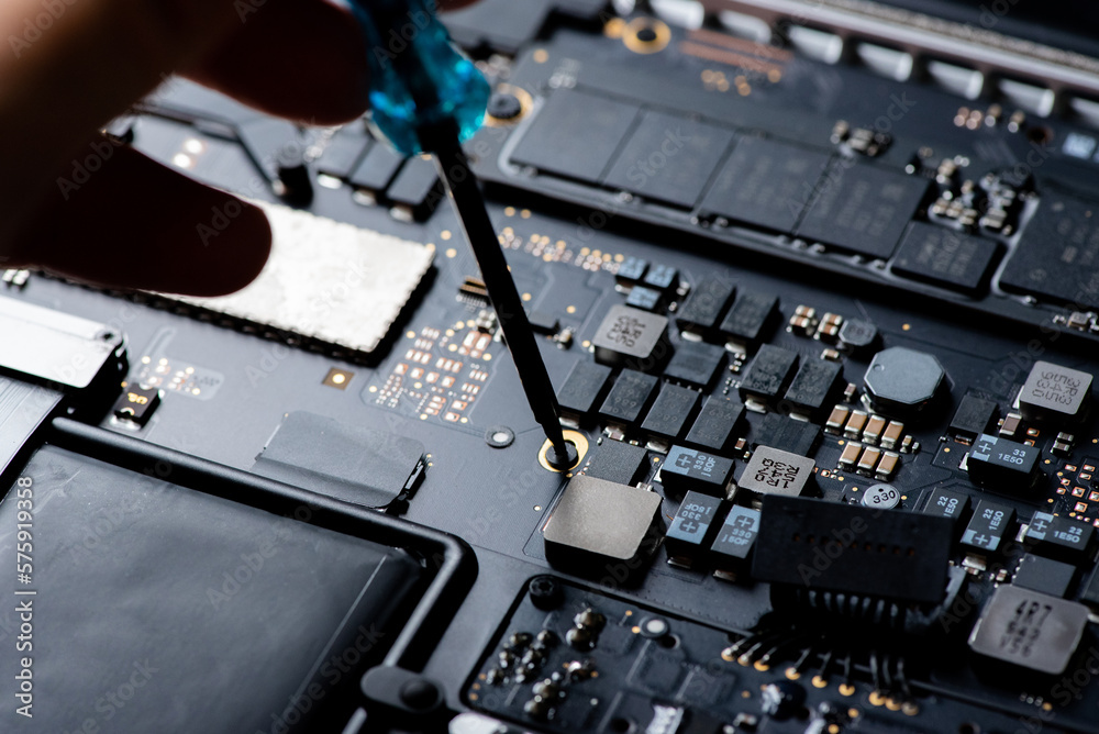 close up of Technician repairing electronic circuit board, repairing, upgrade and technology. close up of Technician repairing electronic circuit board, repairing, upgrade and technology.