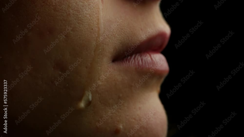 A Tear Running Down a Young Beautiful Woman Face, Macro