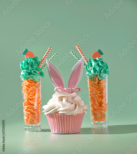 Bunnylicious Delights: Easter Parfait Desserts and Cupcakes with Rabbit Ears on a Pastel Green Background photo