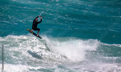 Kiteboarder jumps a wave © ann gadd