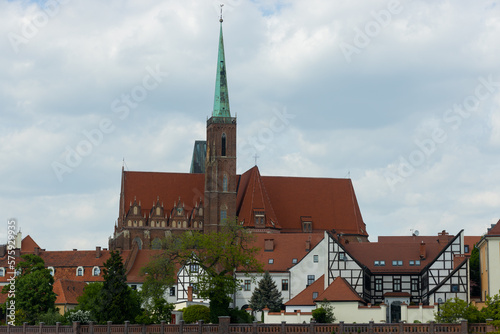 View of the houses and St. John Baptist gothic cathedral on Tumski Island in Wroclaw, Poland