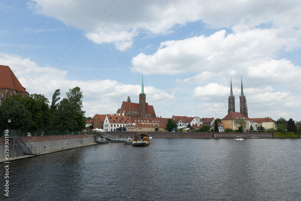 Wroclaw, Poland - May 10, 2022: View of the houses on Tumski Island across the river Odra in Wroclaw. Poland