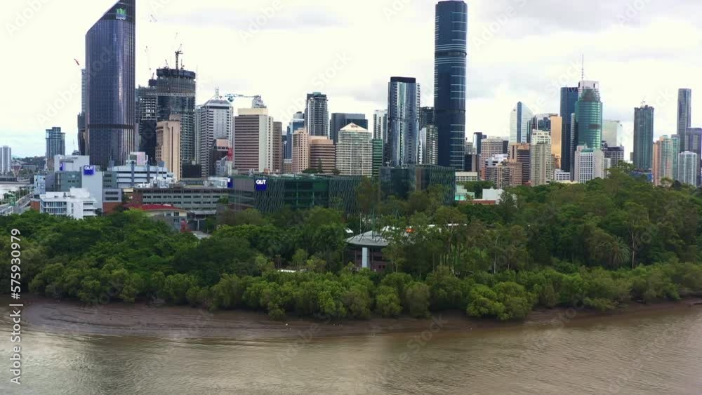 Aerial view drone flyover Brisbane river, elevation shot capturing riverside Queensland University of Technology research institution QUT gardens point campus at downtown Brisbane city. Aerial view drone flyover Brisbane river, elevation shot capturing riverside Queensland University of Technology research institution QUT gardens point campus at downtown Brisbane city.