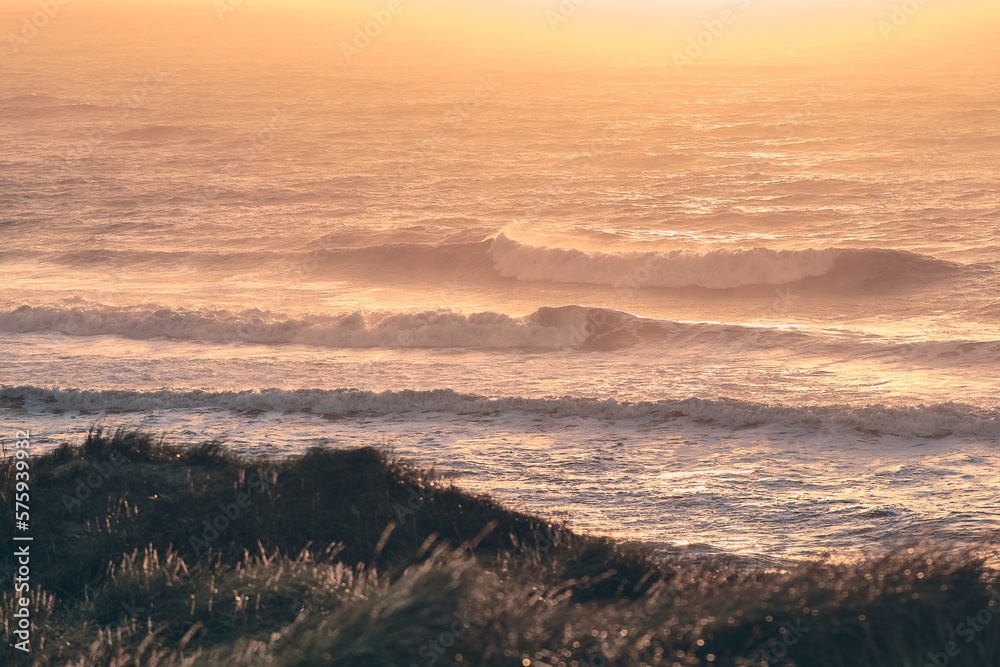 Huge waves at north sea coast in sunset. High quality photo
