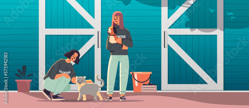 young man woman volunteers with dog and cat animals standing near barn generation Z lifestyle concept