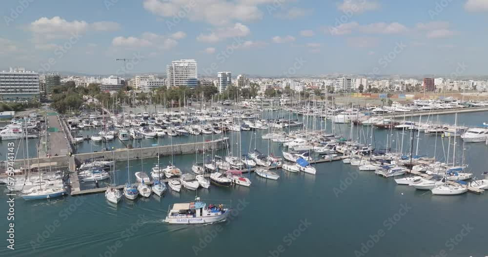 Aerial view of a marina with luxury yachts in Cyprus. Boats moored on the shore of the Mediterranean Sea in a cityscape. High quality 4k footage Aerial view of a marina with luxury yachts in Cyprus. Boats moored on the shore of the Mediterranean Sea in a cityscape. High quality 4k footage