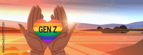 human hands gesture in heart shape lgbt rainbow flag gay lesbian love parade pride festival transgender love generation Z