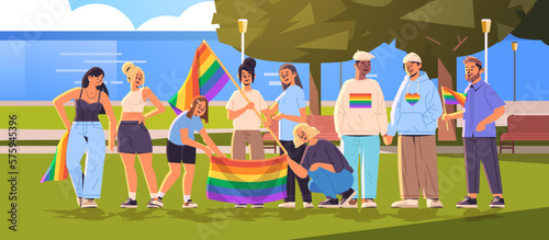 people holding lgbt rainbow flags in urban park gay lesbian love parade pride festival transgender love generation Z
