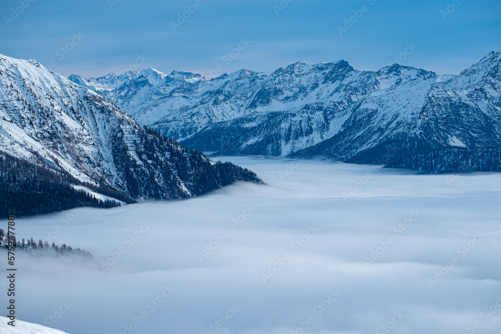 Panorama on Mont Blanc. Mountain wrapped in snow and white clouds. Panorama on Mont Blanc. Mountain wrapped in snow and white clouds.