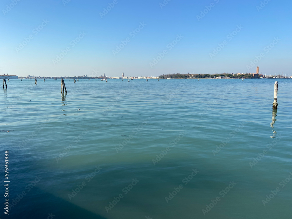 calm water of Venetian Lagoon near promenade of Lido di Venezia district of Venice city in February morming