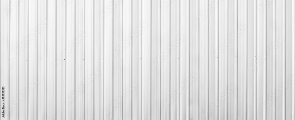 Wide metal aluminum silver corrugated stripe sheet wall background with texture horizontal lines. White or grey metal sheet Wide metal aluminum silver corrugated stripe sheet wall background with texture horizontal lines. White or grey metal sheet