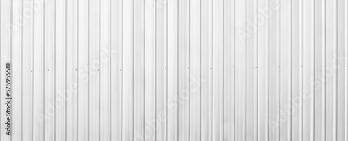 Wide metal aluminum silver corrugated stripe sheet wall background with texture horizontal lines. White or grey metal sheet