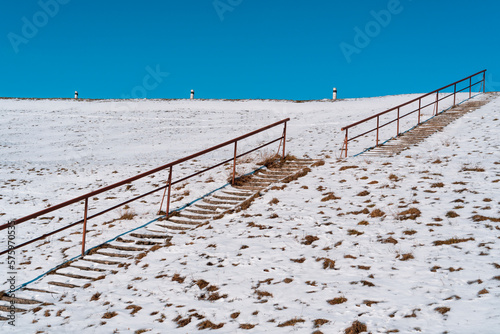 Steps on a high hill lead to the sky