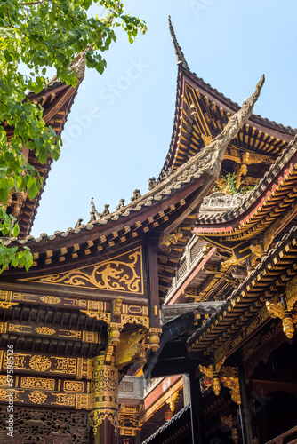 Traditional Chinese architecture details against clear blue sky in BaoLunSi temple Chongqing, China