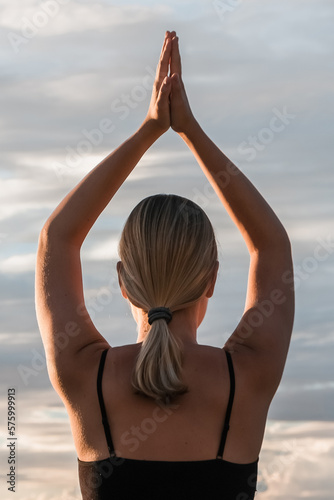 Sport.Fitness outdoor.Fitness instructor goes sports yoga.Sports care for physical and mental health wellness fitness nature yoga practice.Active lifestyle Fitness sea active sport