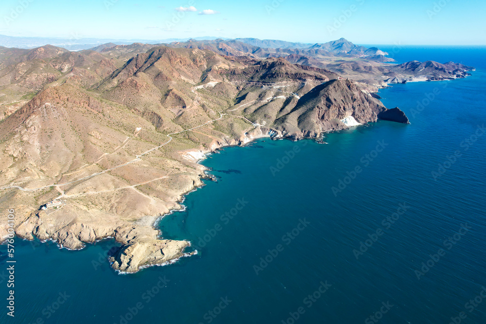 Aerial panoramic view of the coastline and hills of Faro de Cabo de Gata