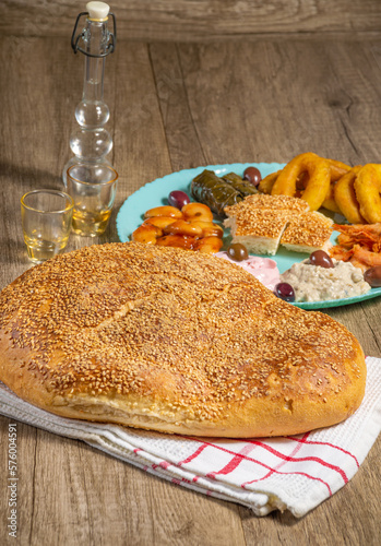 Traditional greek bread ( lagana ) with Greek traditional fasting food for Clean Monday
