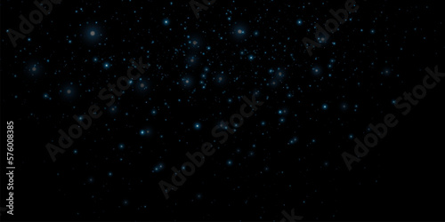 Blue bokeh light background. Glitter effect with particles. Magic dust. Glitter blur texture.