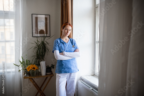 Portrait of young nurse, concept of healthcare in seniors home.