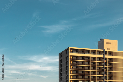 Modern hotel building against the blue sky backdrop.