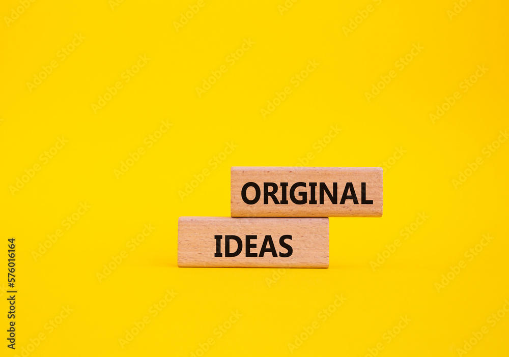 Original ideas symbol. Concept word Original ideas on wooden blocks. Beautiful yellow background. Business and Original ideas concept. Copy space. Original ideas symbol. Concept word Original ideas on wooden blocks. Beautiful yellow background. Business and Original ideas concept. Copy space.