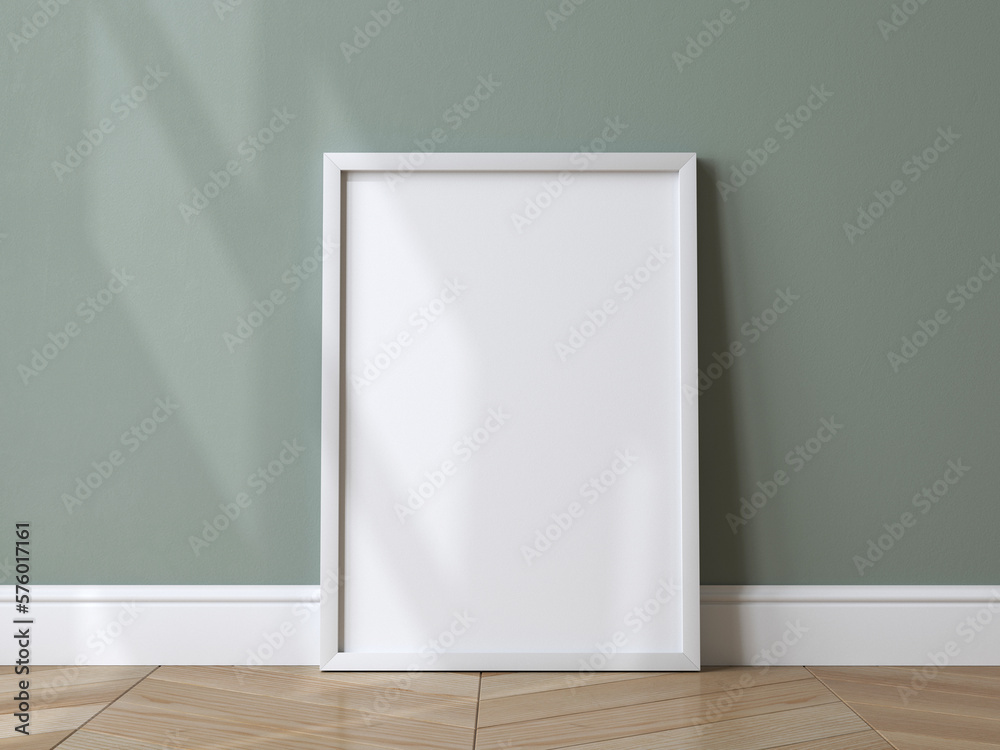 Empty vertical frame, mockup frame, frame on the floor, green wall Empty vertical frame, mockup frame, frame on the floor, green wall