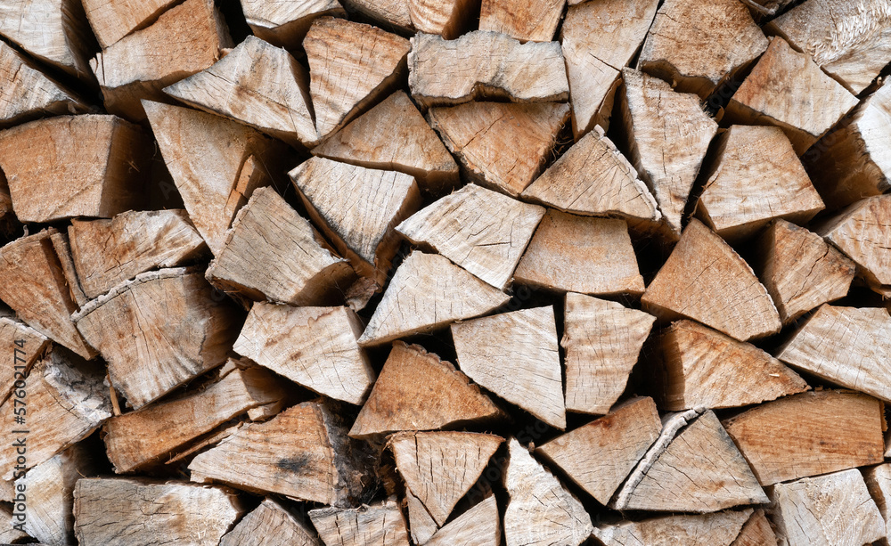 Chopped firewood, neatly stacked and stored for the winter Chopped firewood, neatly stacked and stored for the winter