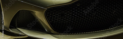 Fotografía luxury beige golden color sports car front grille and bumper spiltter lip close