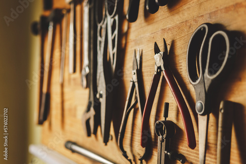 tool board hanging on the wall in the workshop of a jeweler craftsman. High quality photo