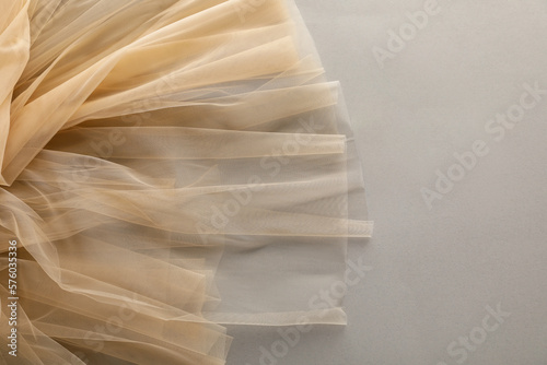 Beautiful tulle fabric on light grey background, top view
