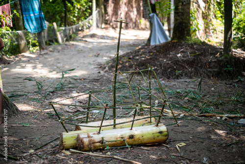 Making of a raft with sticks and bark of banana tree