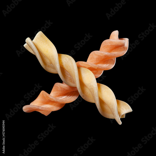 Fusilli, corkscrew-shaped pasta, Italian food, isolated on black background