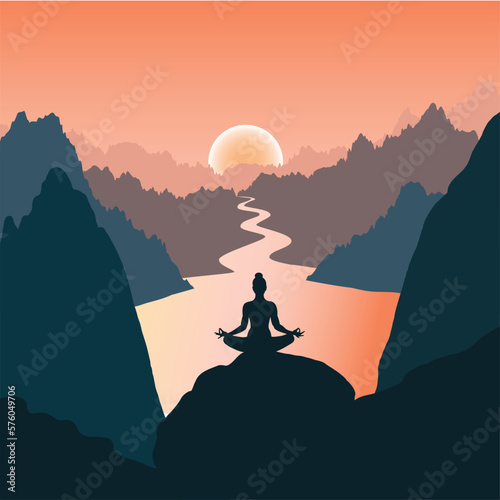 Silhouette of a woman meditating in the mountains at sunrise near the lake.