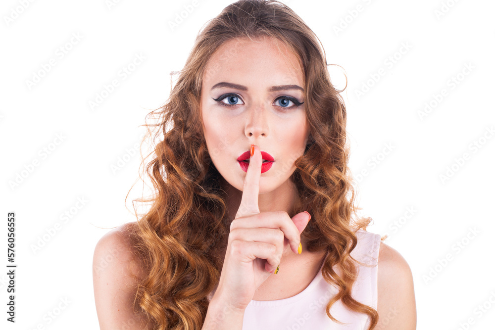Young beautiful blonde woman has put forefinger to lips as sign of silence Young beautiful blonde woman has put forefinger to lips as sign of silence