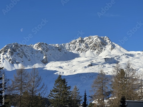 Snow-capped alpine peak Parpaner Weisshorn (2824 m) in the Plessur Alps mountain range (Plessur-Alpen or Plessurgebirge) and over the tourist resort of Arosa - Canton of Grisons, Switzerland (Schweiz) photo