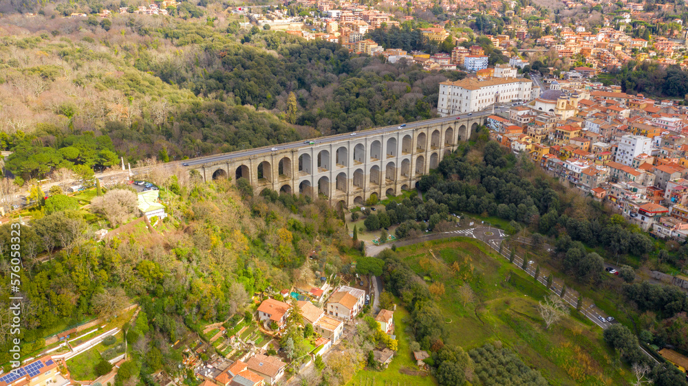 Aerial view of the Ariccia bridge and the homonymous town, near Rome in Italy. It is a monumental road viaduct. The bridge connects the city to the Italian capital.