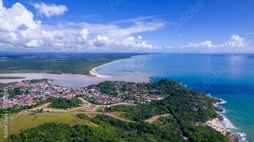 Aerial view of Itacare, Bahia, Brazil. Village with fishing boats and river in the background