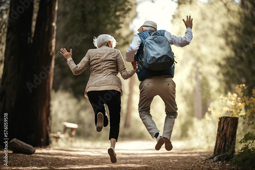 Obraz na plátne fröhliches Seniorenpaar springt im Park, generative AI