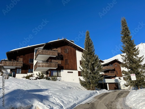Swiss alpine holiday homes, mountain villas and holiday apartments in the winter ambience of the Swiss tourist winter resort of Arosa - Canton of Grisons, Switzerland (Schweiz)