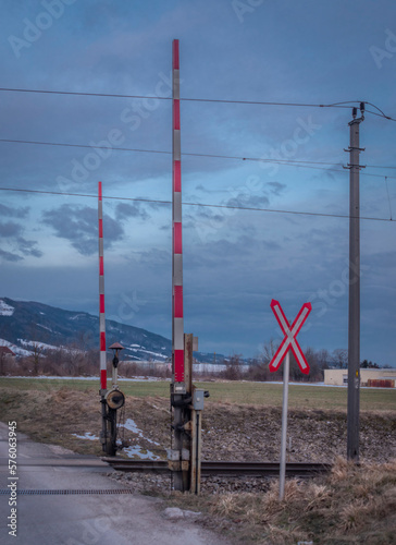 Railway and road crossing near Micheldorf im Oberosterreich in winter morning photo