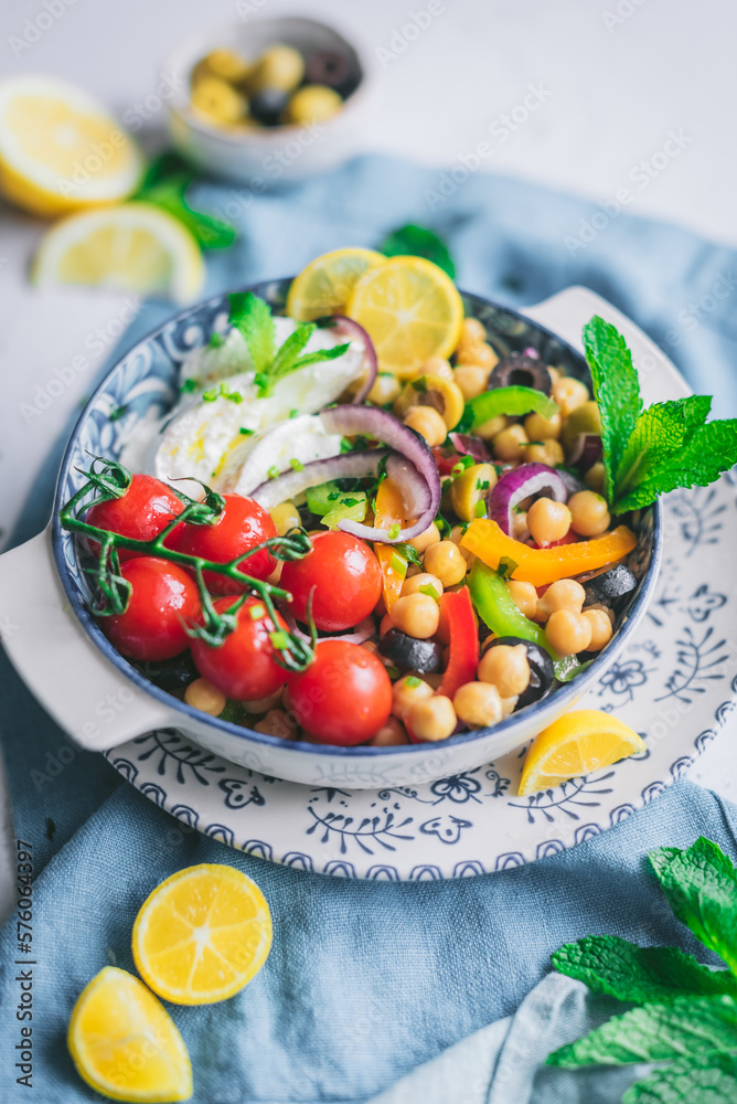 Healthy salad with tomatoes and lemon slices Healthy salad with tomatoes and lemon slices