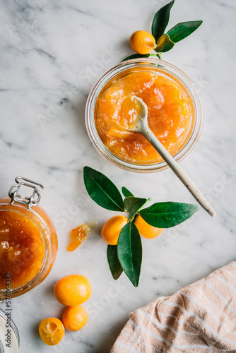 Glasses of kumquat jam with fruits