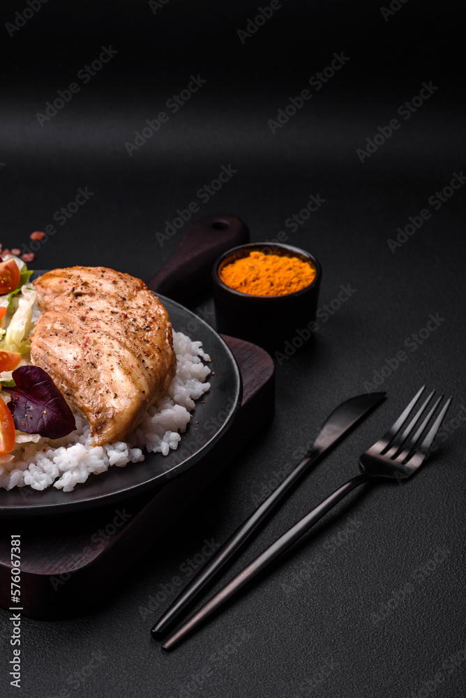Delicious healthy breakfast consisting of chicken, rice, greens and cherry tomatoes Delicious healthy breakfast consisting of chicken, rice, greens and cherry tomatoes