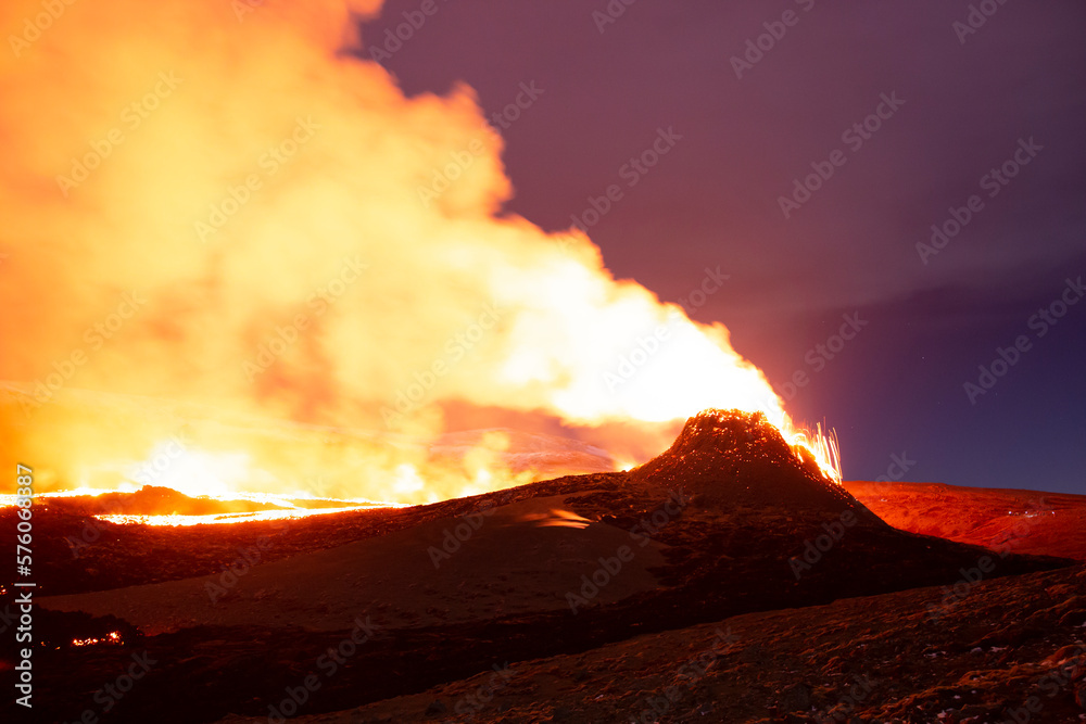 Volcanic valley bright eruption night landscape, Iceland