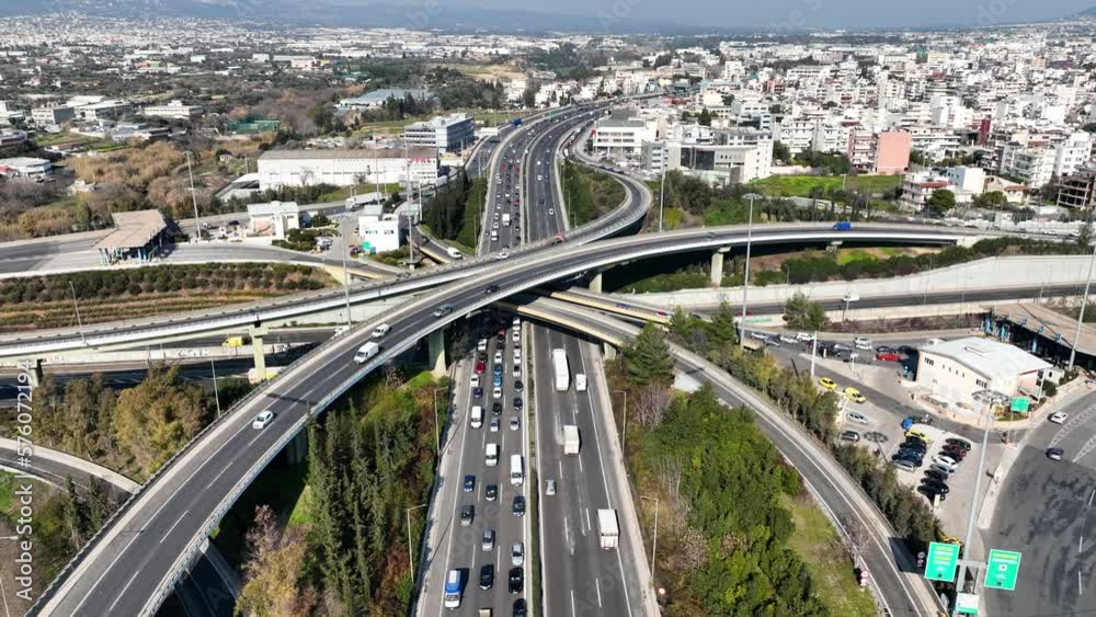 Aerial drone video of modern multilevel junction with crossing bridges, passing through National road of Athens and Attiki odos motorway Aerial drone video of modern multilevel junction with crossing bridges, passing through National road of Athens and Attiki odos motorway