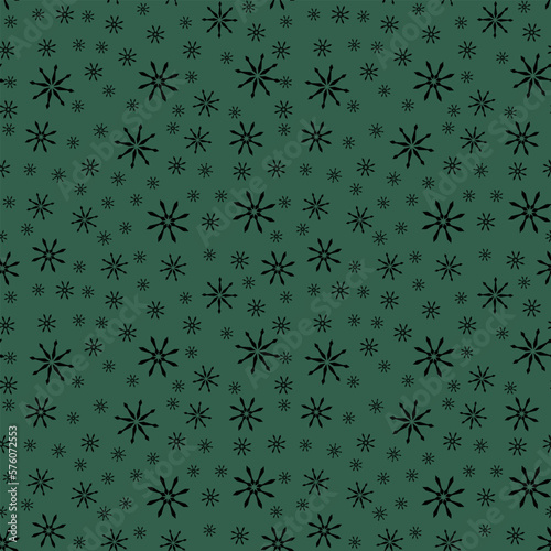 seamless pattern of snowflakes on a green background
