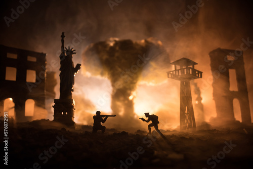 Conceptual image of war between Democracy and dictatorship using toy soldiers. Battle in ruined city.
