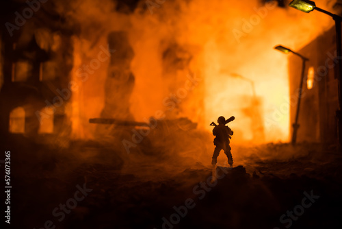 Military soldier silhouette with bazooka. War Concept. Military silhouettes fighting scene on war fog sky background  Soldier Silhouette aiming to the target at night.